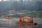 Chinese boating in the morning and fog floating on the water