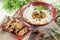 Chinese bowl of noodle with fried pork ribs and herbs on the tab