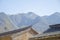 Chinese brick roof on the background of mountains, great Chinese wall