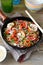 Chinese buckwheat noodles with spicy shrimp in a frying pan