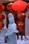 Chinese Buddhist statue and red lanterns.