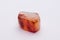 Chinese carnelian gemstone with smooth surface white orange and deep rep tones isolated