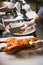 Chinese chef cooking peking roasted duck at the kitchen of restaurant