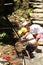 Chinese children wash hands in bamboo water drain