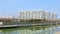 Chinese cityscape with buildings reflecting on the lake