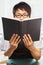 Chinese college male student holding book