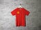 Chinese Communist Party flag on shirt and hanging on the wall with brick pattern wallpaper