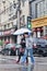 Chinese couple with umbrella crosses the street, Shanghai, China