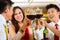 Chinese couples toasting with wine in restaurant