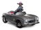 Chinese Crested dog driving convertible