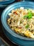 Chinese cuisine, fried rice with egg omelet, mushrooms and vegetables