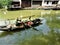 Chinese details: river, traditional buildings, boat and birds