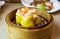 Chinese dimsum shrimp shao mai in bamboo steamer