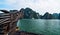 Chinese dragon head wood carving Cruise is a traditional wooden junk sailing Rocky islands the emerald waters of Ha Long Bay