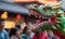 A Chinese dragon opens its mouth against the backdrop of a festival. Chinese traditional dragon dance