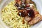 Chinese egg noodles roasted chicken dressing Teriyaki Japanese sauce on bowl