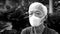 Chinese elderly man wearing mask N95 protect from Coronavirus infection black and white