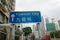 Chinese and English blue direction sign of Kowloon City