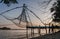 Chinese fishing nets during the Golden Hours at Fort Kochi, Kerala, India sunrise fisherman work