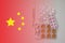 Chinese flag on background of pills and thermometer: pandemic virus infection from Wuhan, China, novel Coronavirus outbreak