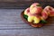 Chinese flat donut peaches in the basket on on old wooden table also known as Saturn donut, Doughnut peach, Paraguayo.Healthy eati