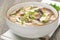Chinese food - a bowl of soup with chicken, shiitake mushrooms