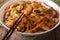 Chinese Food: Chow mein with chicken and vegetables close-up.