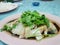 Chinese food style, boiled chicken meat topped with coriander in pink plate