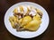 Chinese food style, Top view of boiled chicken meat in white plate on wooden table