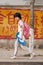Chinese girl walks back home after school, Sanay, Hainan, China