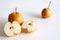 Chinese golden pears set Nashi variety isolated on white background two round whole section half and slice.Food concept.