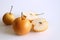 Chinese golden pears set Nashi variety isolated on white background two round whole section half and slice.Food concept.