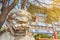 Chinese guardian lion sculpture in front of ancient Buddhist Lama temple in scenic morning light