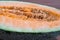 Chinese Hami melon cut in half closeup view