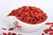 Chinese herbs wolf berry Goji berryes pile over white isolated
