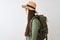Chinese hiker woman wearing canteen hat glasses backpack over  white background looking to side, relax profile pose with