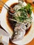 The Chinese homemade delicious fresh stream sea bass fish which soy sauce