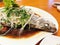 The Chinese homemade delicious fresh stream sea bass fish which soy sauce