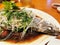 The Chinese homemade delicious fresh stream sea bass fish which soy sauce