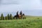 Chinese Kazakh herdsmen riding horse in grasslan