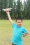 Chinese kid holding model plane ready for fly