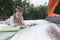 Chinese kid lying on front reading outdoor