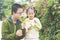 Chinese kids explore white flowers on branches