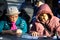 Chinese ladies playing cards in Columbus Park, NYC