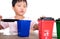 Chinese little girl playing with sorting garbage bin toys