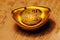 Chinese lucky gold ingot on calligraphy backgr