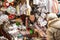 Chinese man in his market stall sells tailor equipments