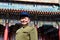 Chinese man wearing Mao Tzetung suite and hat in Beijing China