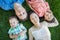 Chinese Mother, Caucasian Father and Mixed Race Children Laying on Grass