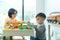 Chinese Mother and Little boy playing colourful blocks toy